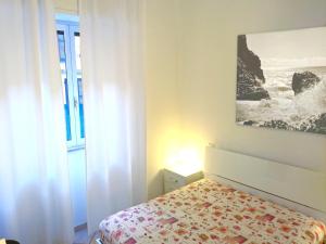 A bed or beds in a room at Grottammare mon amour Kira