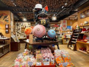a store with a pig statue in the middle of a store at Guest houseTakagi - Vacation STAY 59903v in Matsumoto
