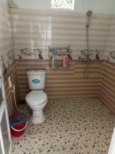 a bathroom with a toilet in a room at Homstay Hưng Yên - Long Cốc 