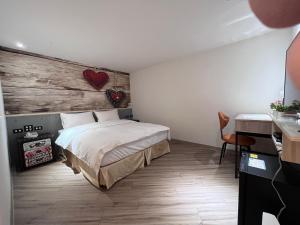 A bed or beds in a room at Good Time Boutique Hotel