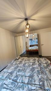 a bedroom with a large bed in a room at GP Luxury Apartment in Schönenwerd