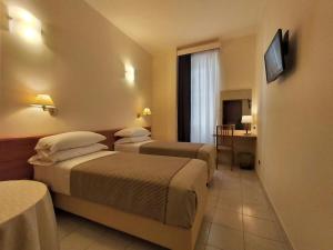 TV a/nebo společenská místnost v ubytování Hotel Principe Eugenio