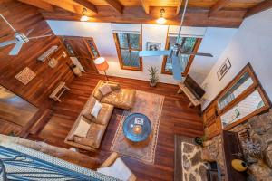 an overhead view of a living room with wood floors at The Enchanted Stone Cottage in Margaret River Town