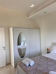 a bedroom with a mirror and a bed at Carsija Life 2 in Avsallar