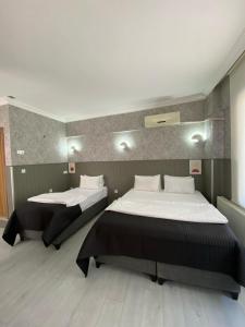 Postel nebo postele na pokoji v ubytování Koc Hotel