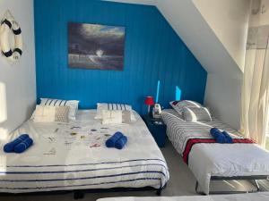 Postel nebo postele na pokoji v ubytování La Villa KEROMER