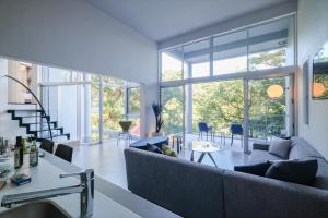 a living room with a couch and a table at RIVERSIDE TERRACE OKINAWA KADENA in Kadena