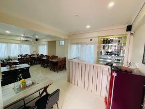 a restaurant with a bar and a dining room at Hotel Janakpur Inn in Janakpur