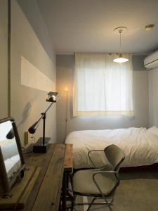 Postel nebo postele na pokoji v ubytování Apartment Hotel Shinjuku