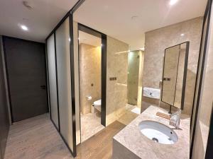 a bathroom with a sink and a toilet at ZHome-Deplex luxury apartment-Near The Bund in Shanghai