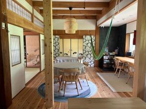 a dining room with a table and chairs at Whole house rental inn Umu - Vacation STAY 60715v in Maibara