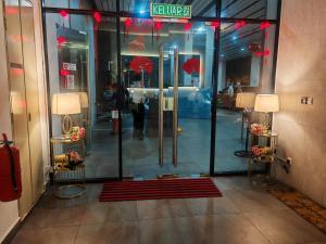 a lobby with a revolving door in a building at Puchong HELLO KITTY FULLY AIR-CON Suite in Puchong