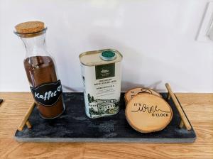 a tray with a bottle of beer and a cookie at Seeloft Senftenberg in Senftenberg