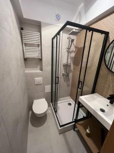 Kúpeľňa v ubytovaní Franciszkanska Blueberry Apartment