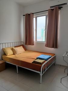 a bed in a room with a window at NurAz Residensi Adelia2, Bangi Avenue, Free wifi, Pool in Kajang