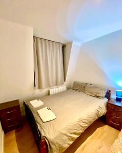 a small bed in a room with a window at One Bedroom Apartment in Ealing Broadway London in Ealing