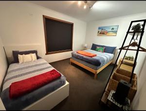 a bedroom with a bed and a couch in it at OwLHouse on Island in Cowes