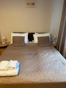 Postel nebo postele na pokoji v ubytování Hotel Jerevan