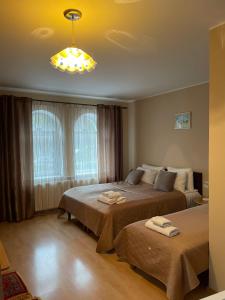 Postel nebo postele na pokoji v ubytování Hotel Jerevan