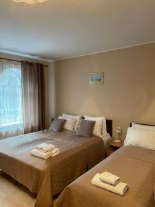 Postel nebo postele na pokoji v ubytování Hotel Jerevan