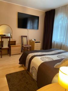 Postel nebo postele na pokoji v ubytování Hotel Jerevan