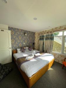 Cama o camas de una habitación en Heritage Rose Inn