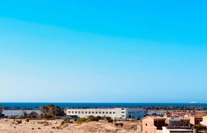a view of a city with the ocean in the background at Casa di Jack I.U.N. R6217 in Quartu SantʼElena