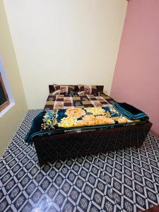 Кровать или кровати в номере Ashu Homestay