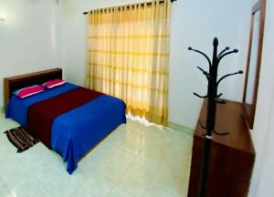 Letto o letti in una camera di Punchi Walawwa - Guest House - Holiday Bungalow