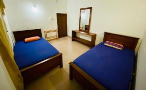 Letto o letti in una camera di Punchi Walawwa - Guest House - Holiday Bungalow