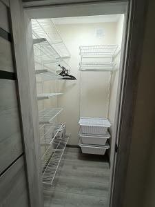 a hallway with empty shelves in a closet at Квартира посуточно in Kokshetau +1 photo