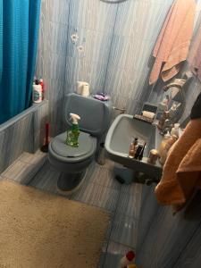 a toy bathroom with a toilet and a sink at Μεζονέτα στους Αγίους Δέκα Κέρκυρας in Áyioi Dhéka +37 photos