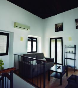 a living room with a couch and a table at Apartamentos Fariñas 11 in Sanlúcar de Barrameda