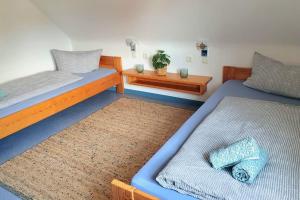 Postel nebo postele na pokoji v ubytování Inselhuus Windkieker Fehmarn