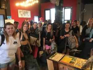 a group of people standing in a room at Vangvieng Rock Backpacker Hostel in Vang Vieng