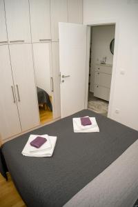 Postel nebo postele na pokoji v ubytování Apartment Infinity