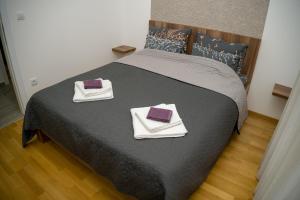 Postel nebo postele na pokoji v ubytování Apartment Infinity