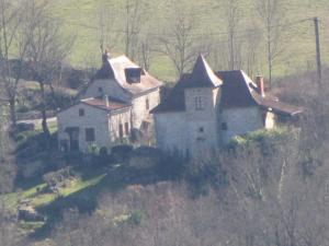 an old house on the side of a hill at Domaine Mas de Galy in Saujac