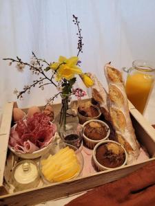 a box of food with bread and other foods at Domaine Mas de Galy in Saujac +11 photos