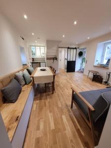 a living room with a couch and a table at Domaine Mas de Galy in Saujac