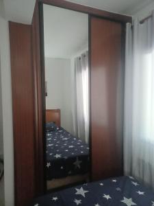 Ein Bett oder Betten in einem Zimmer der Unterkunft Alojamientos O Camiño