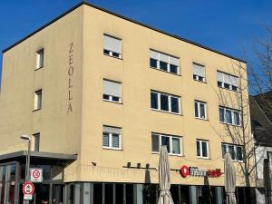 a large building with the word hotel on it at Moderne Ferienwohnung für 4 Personen im Herzen von Marl*Netflix*Nespresso* in Marl