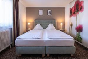 Postel nebo postele na pokoji v ubytování Hotel Pension Waldesruh
