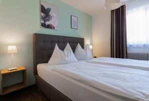 Postel nebo postele na pokoji v ubytování Hotel Pension Waldesruh
