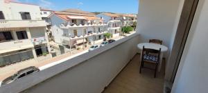 a balcony with a view of a city at Azzurro apartamento Calabria in Marina di Strongoli