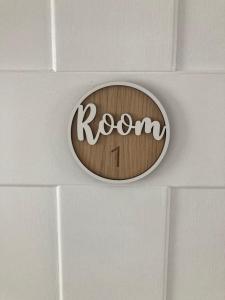 a sign on a wall with the word room on it at Private Double Room with Ensuite, No Breakfast, Truro City Centre in Truro