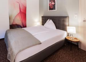 Postel nebo postele na pokoji v ubytování Hotel Pension Waldesruh