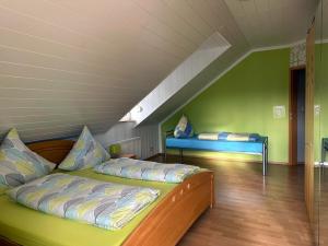 a bedroom with two beds in a attic at Ferienwohnung Hochwaldblick 1 in Morbach