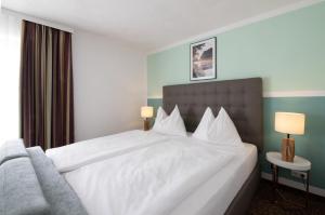 Postel nebo postele na pokoji v ubytování Hotel Pension Waldesruh