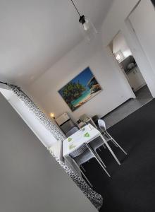 an overhead view of a living room with a table and a tv at Charmed HomeStay - Zaczarowany in Warsaw